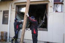 Volunteer Work - Removing debris from a building