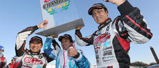Happy champions: Nobuteru Taniguchi (right), team director Ukyo Katayama (center) and Tatsuya Kataoka