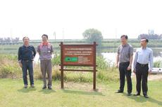 Hangzhou Yokohama Tire President Tetsuya Nagao (second from left) poses with guests after unveiling the commemorative sign