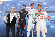 Tom Chilton is all smiles at the top of the podium