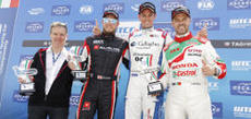 Tom Chilton is all smiles at the top of the podium