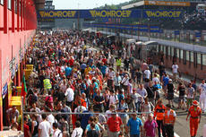 Crowds gather in the pit lane